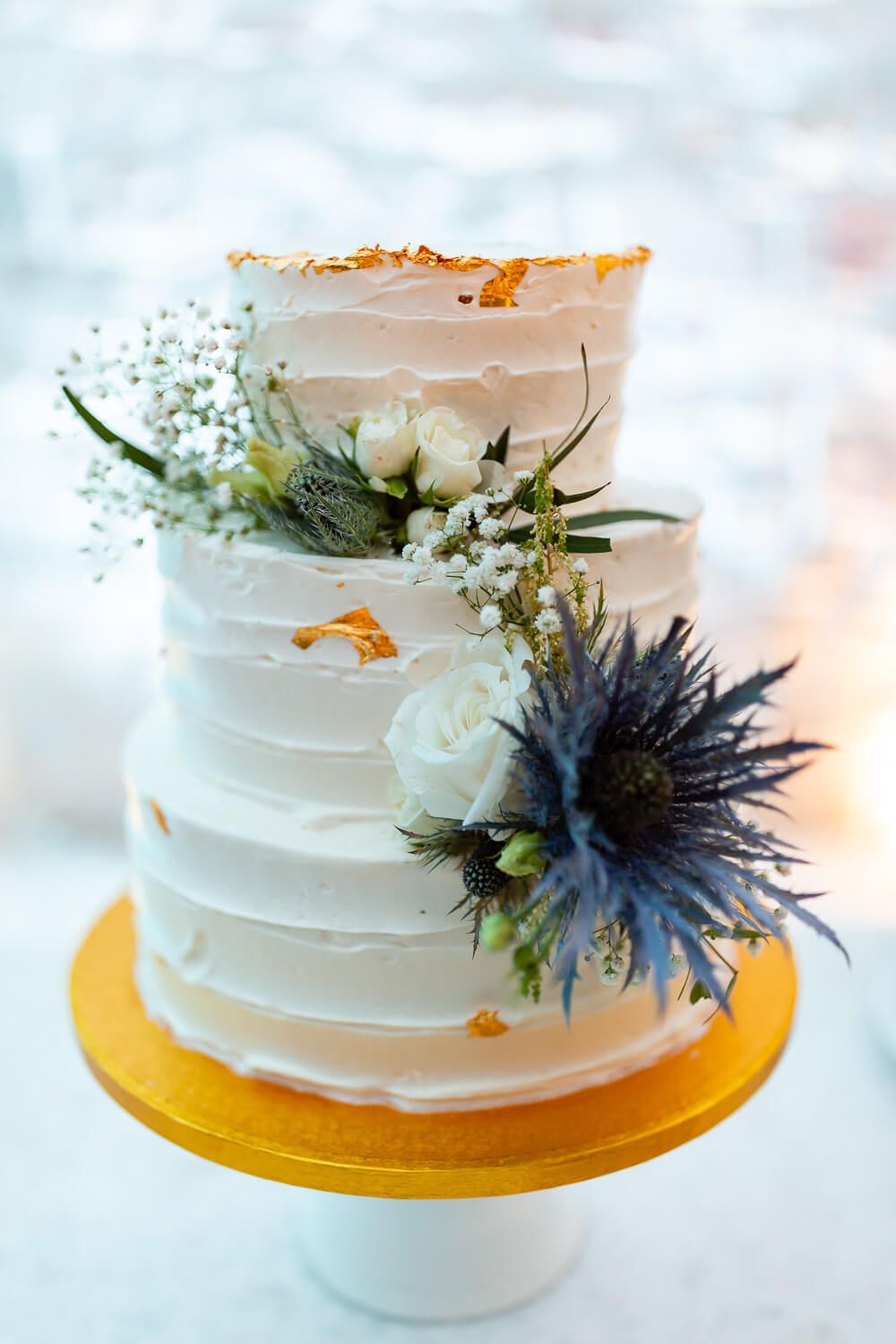 Wedding cake cutting ceremony in the outdoor area of the Villa Aethra Paros