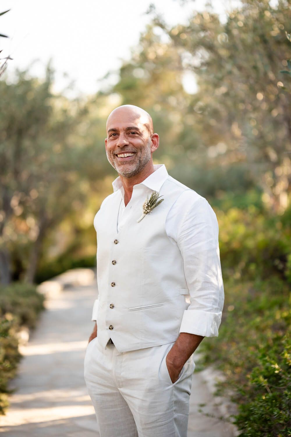 Groom Dean getting ready for his small wedding celebration in Greece