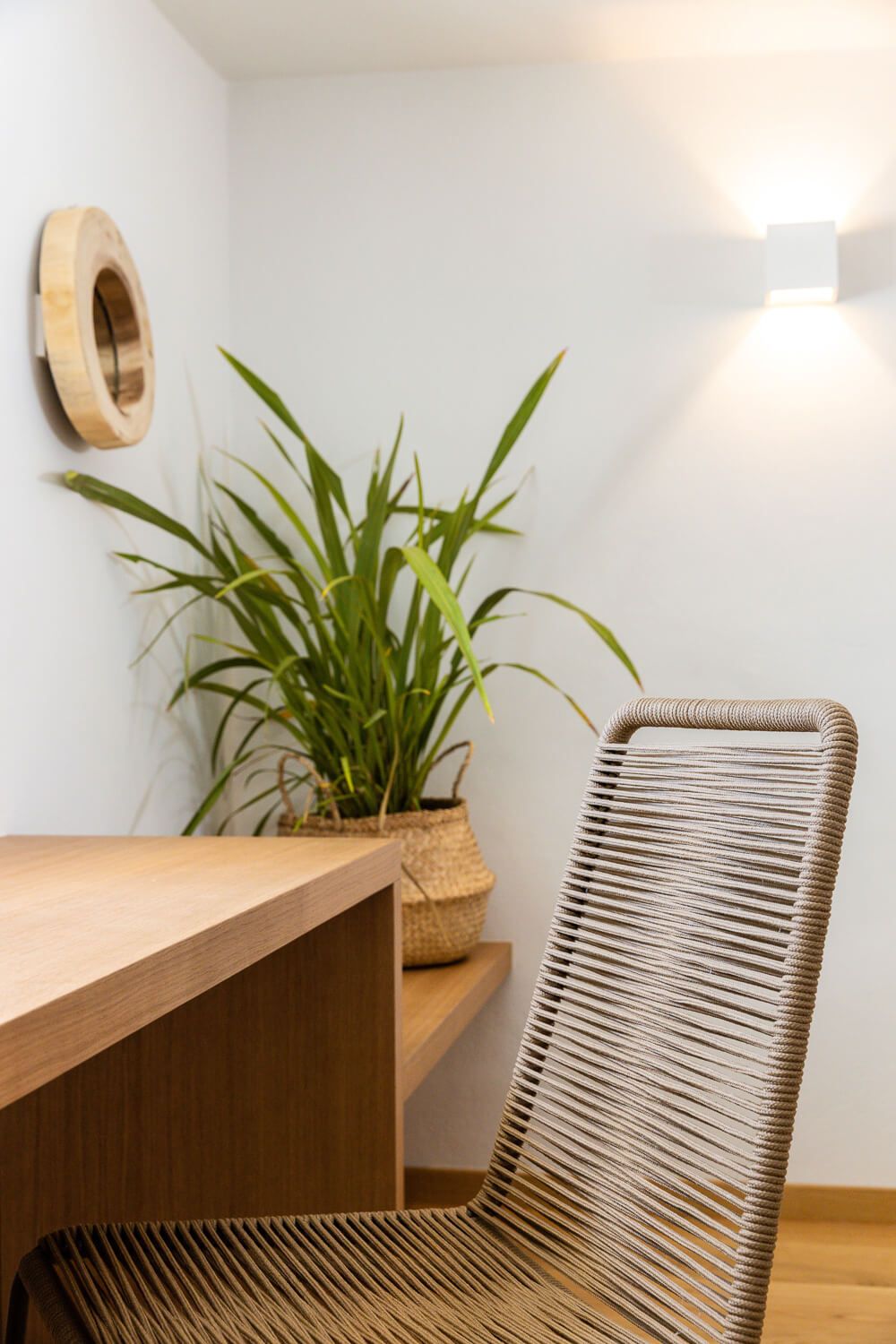 Modern wooden desk with rope chair showcasing interior design in a luxury villa in the Cyclades.