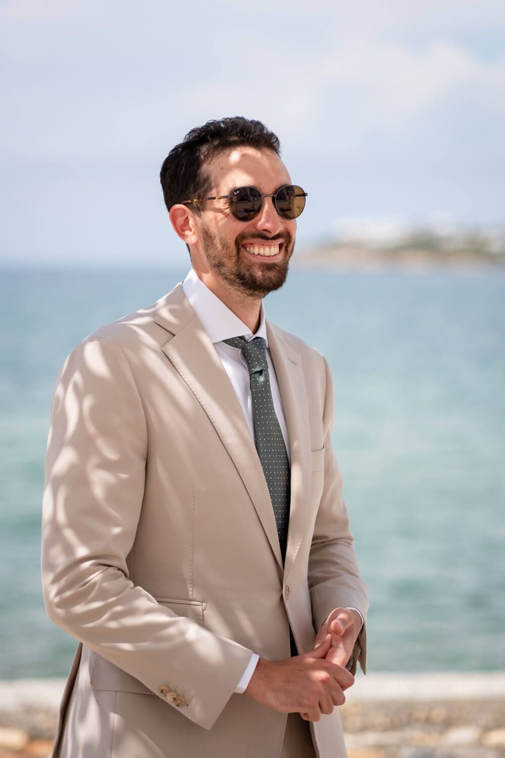 Portrait of a stylish groom before his destination wedding in Greece