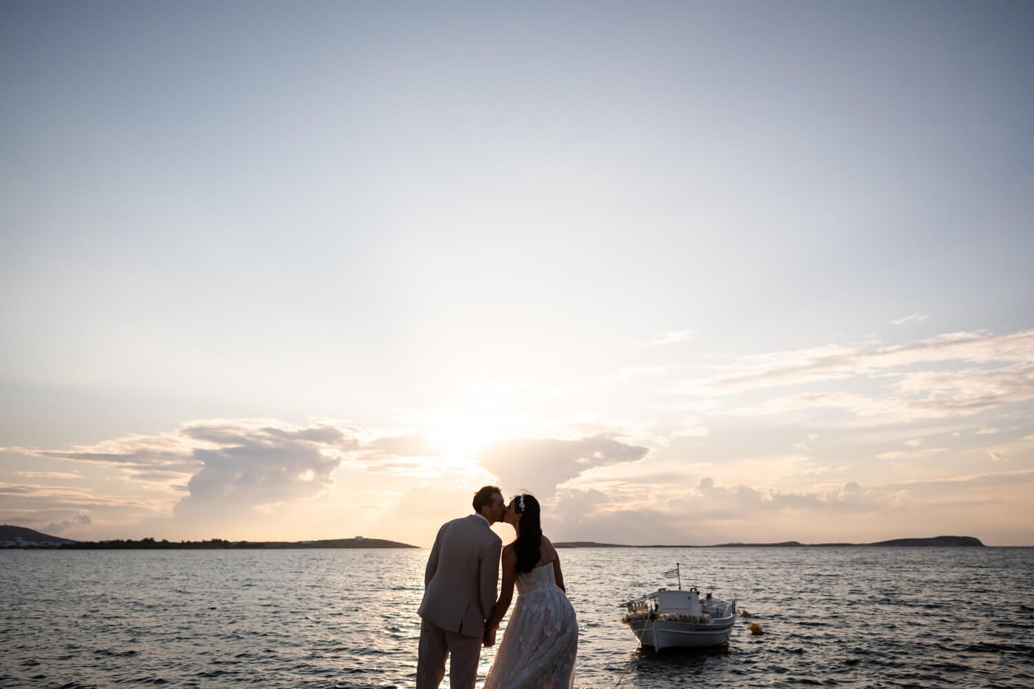 Cinematic wedding portraits at the edge of the water in Seesoo