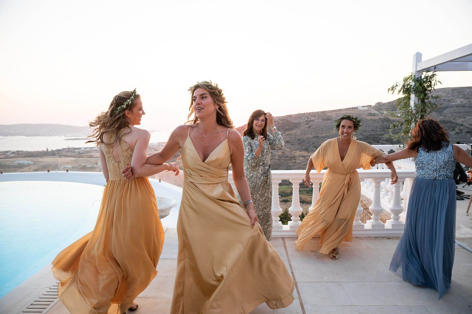Guests dancing in circles for the traditional Hora at Paros wedding