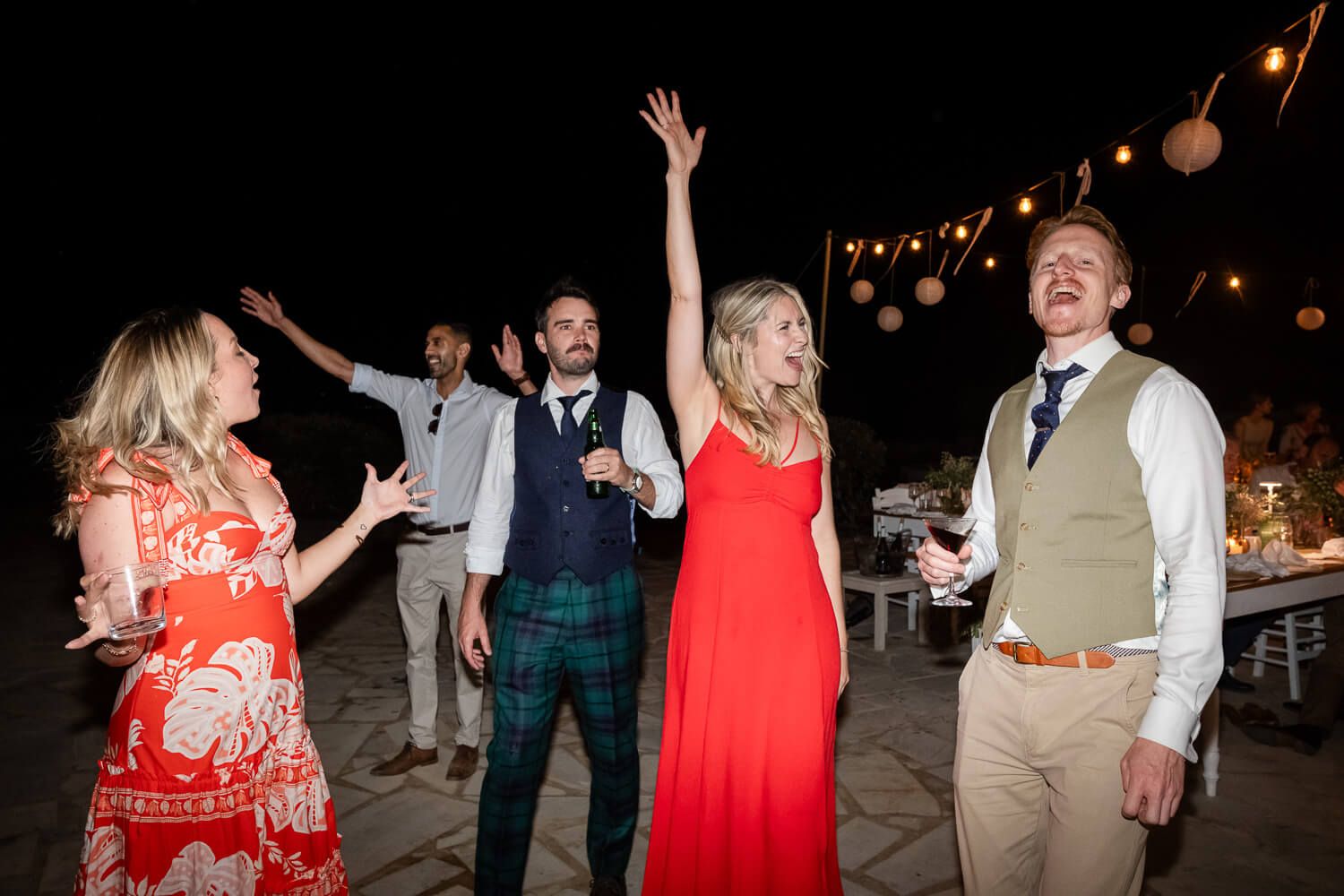 Guests dancing and celebrating at a Greek island destination wedding