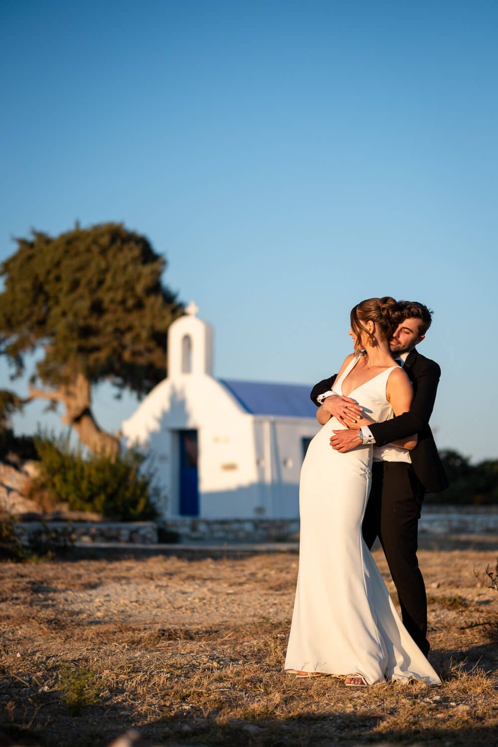 Sun-kissed wedding photography in the scenic village of Ambelas
