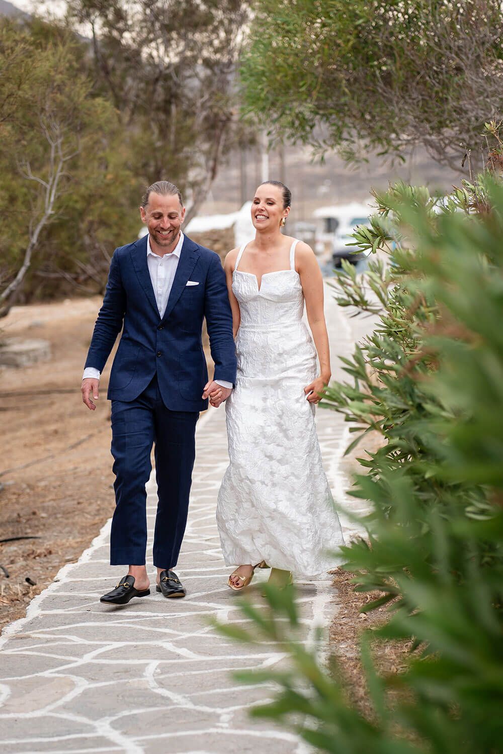 Couple walking through the wild natural landscape of Monastiri Paros