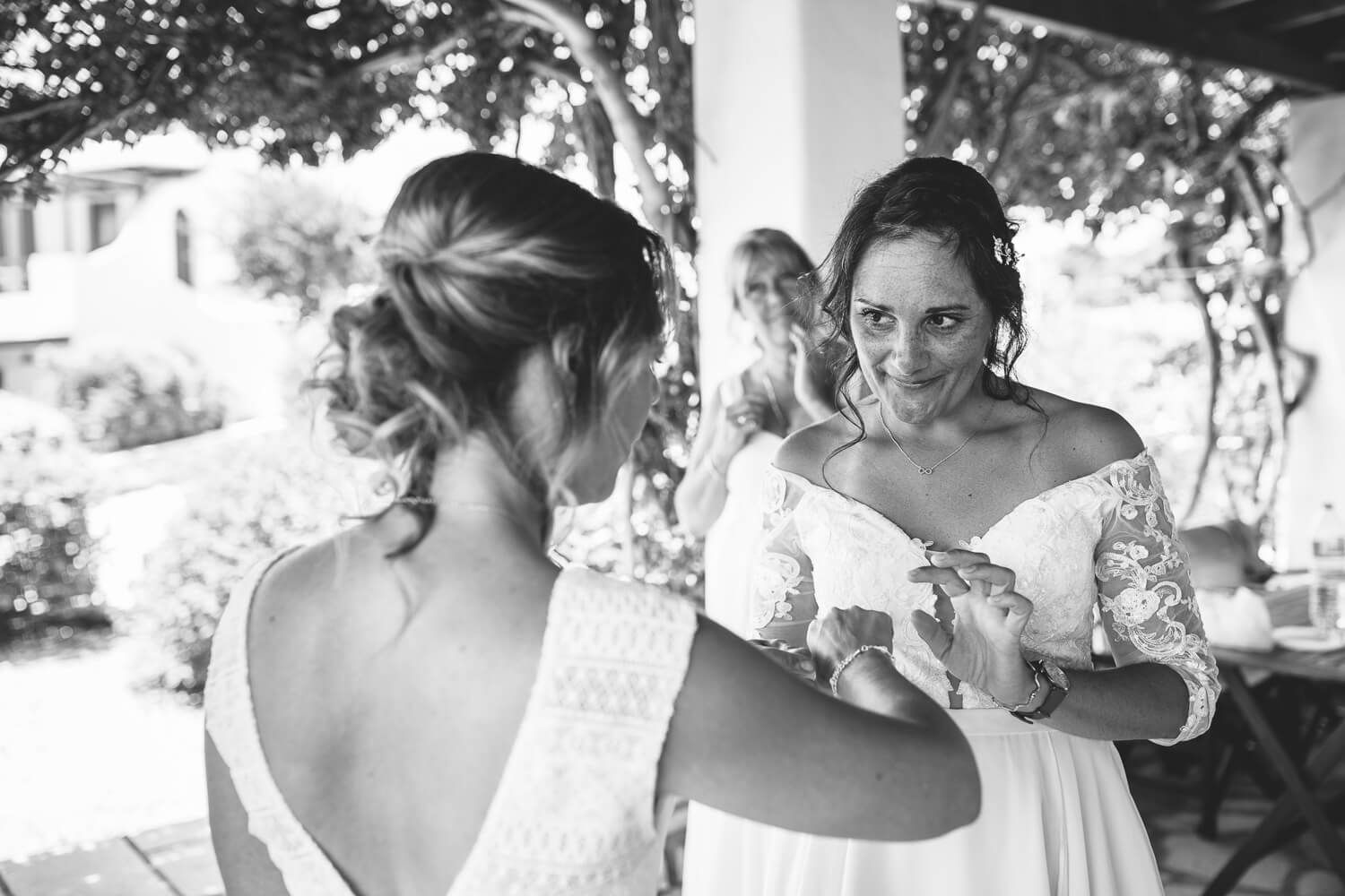 Bride smiling with her bridesmaids before the symbolic ceremony in Paros