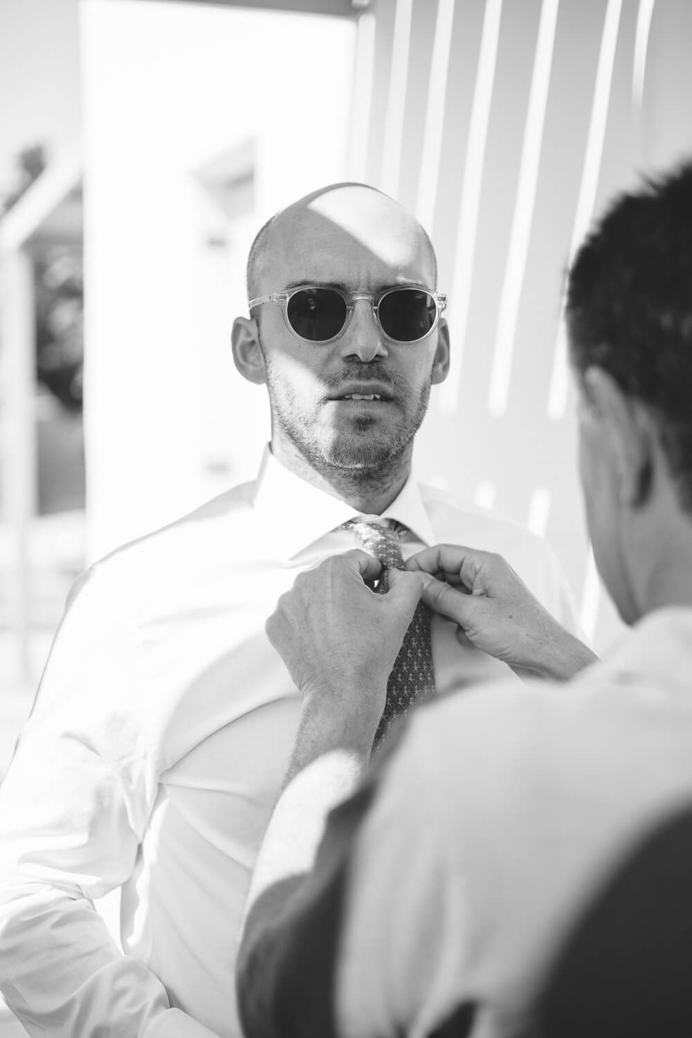 Groom Dimitris getting ready before his wedding in Paros