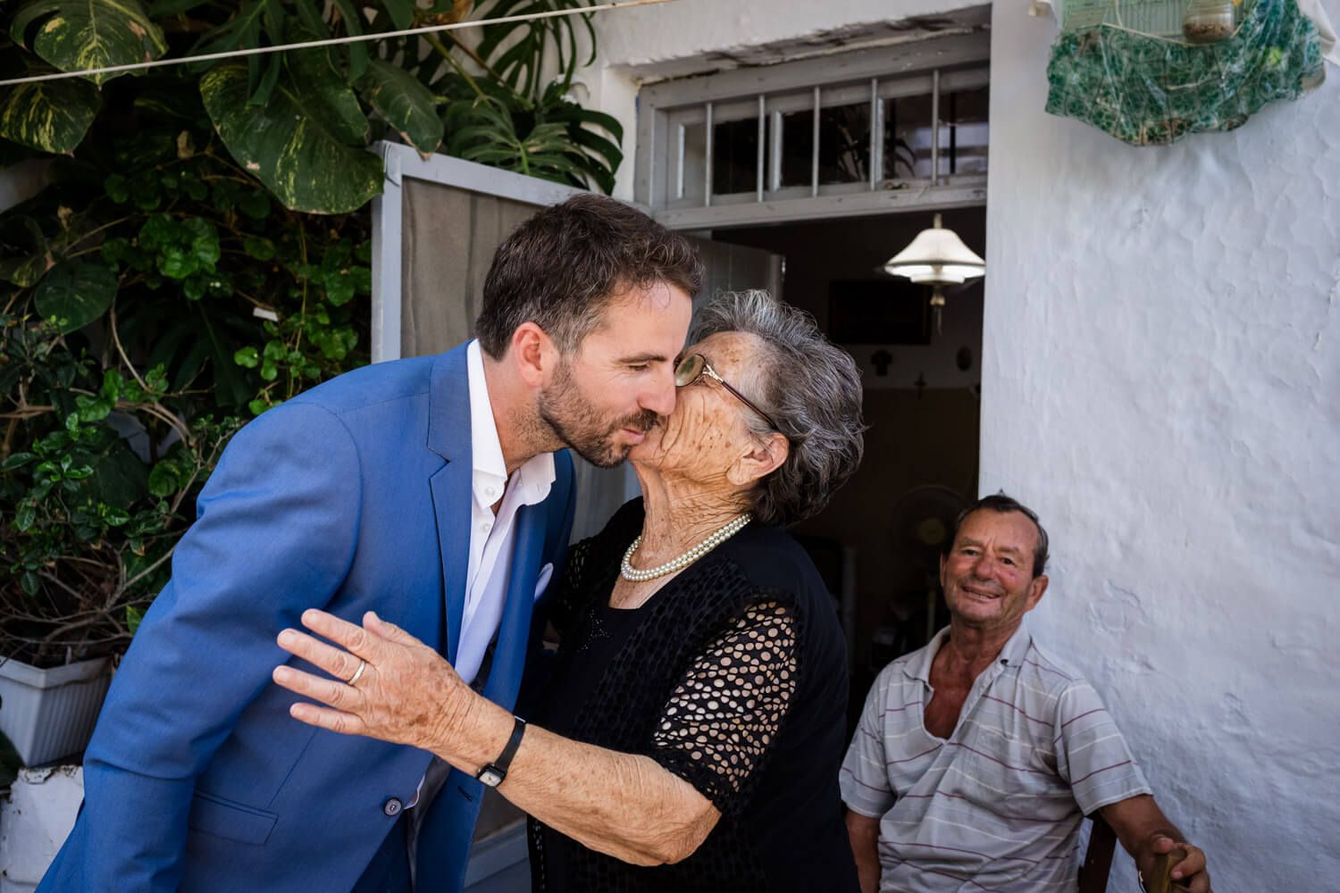 Family moments during groom preparation in a Pachena village home