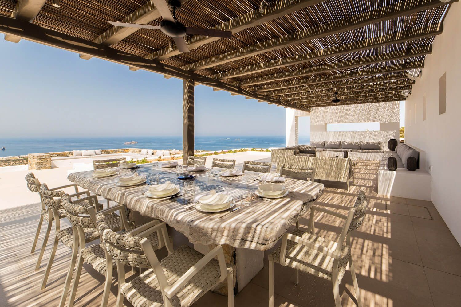 Intimate outdoor dining area complementing a 3-level Paros villa