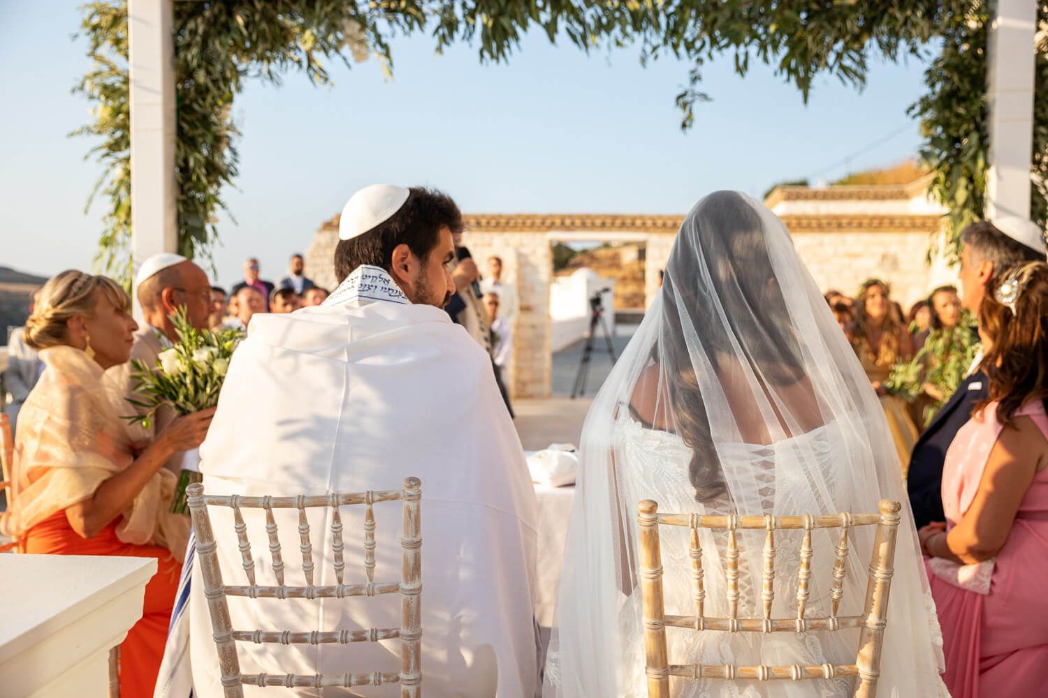 bride and groom during Jewish wedding at Villa Aethra Paros
