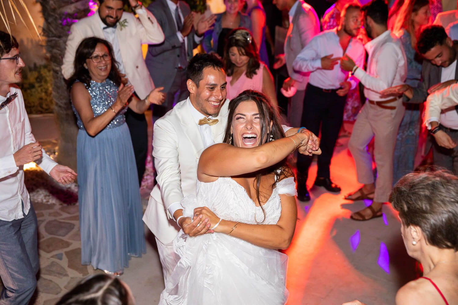 Candid moments of joy during Jewish wedding celebration in Greece