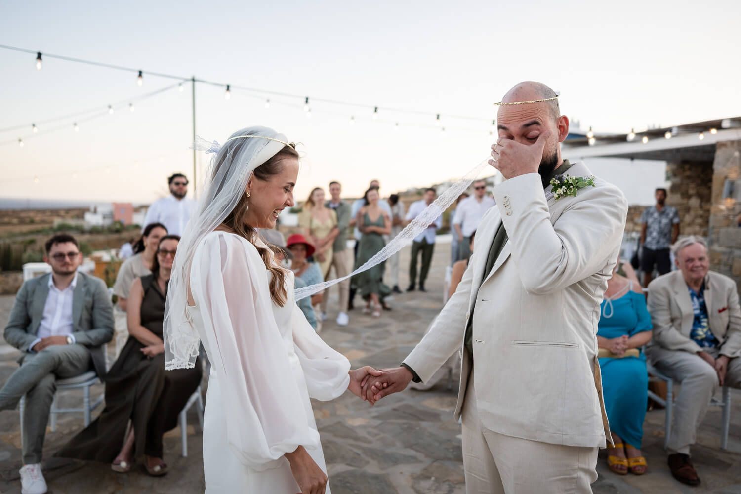 Guests smiling and wiping tears during the touching ceremony at Fladakia Estate