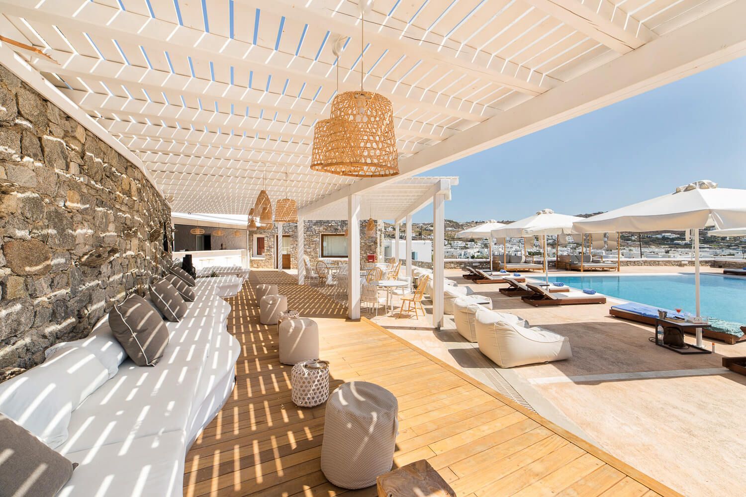 . Sunlit exterior lounge spaces designed for elite hotel guests
