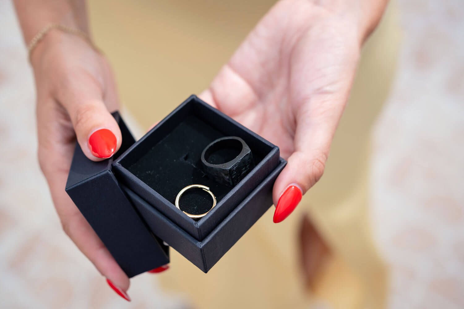 Close up of the the wedding rings during an intimate wedding ceremony in Paros