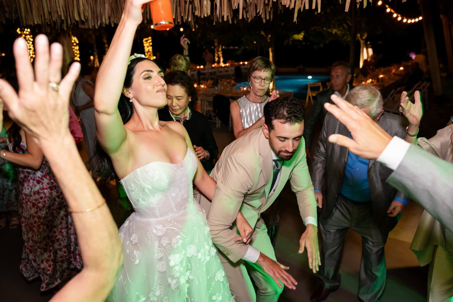 Black and white photo from a wedding party at Seesoo Paros with guests dancing