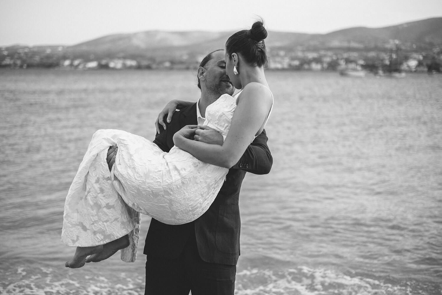 Newlyweds cheering and celebrating after their private villa ceremony