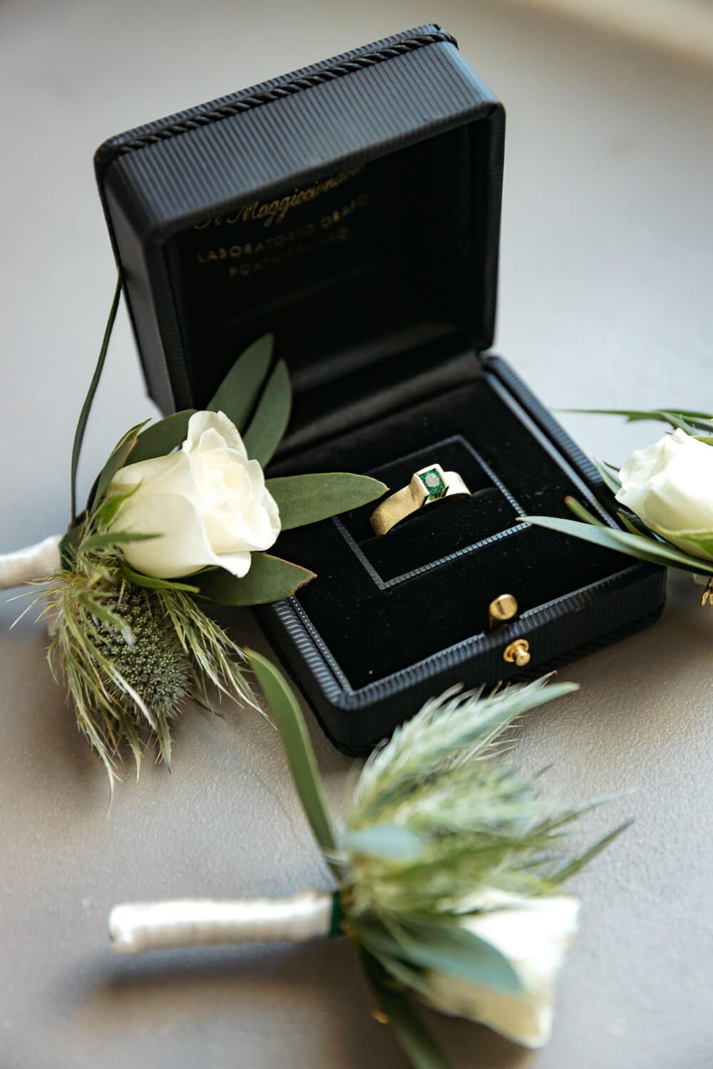 Bridal jewelry and rings laid out on a marble surface