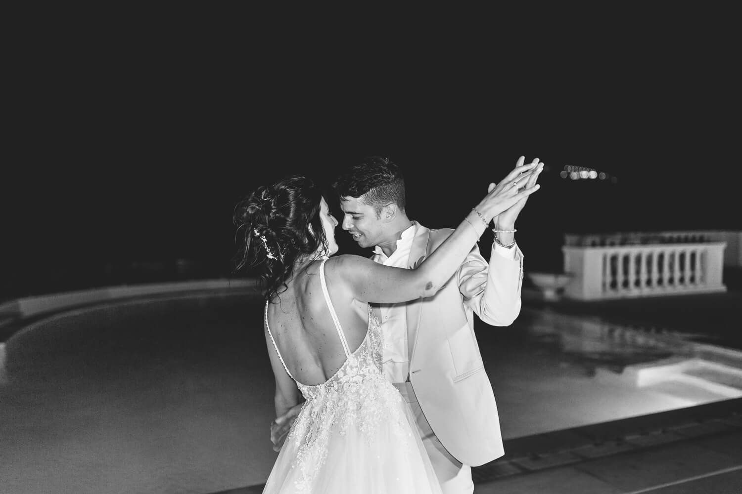 Newlyweds sharing their first dance under the starry Paros sky