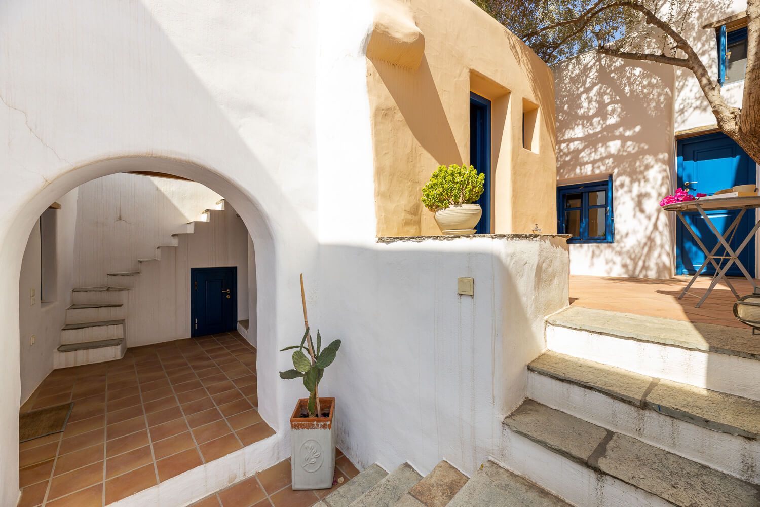 Minimalist white curves defining traditional Greek island architecture