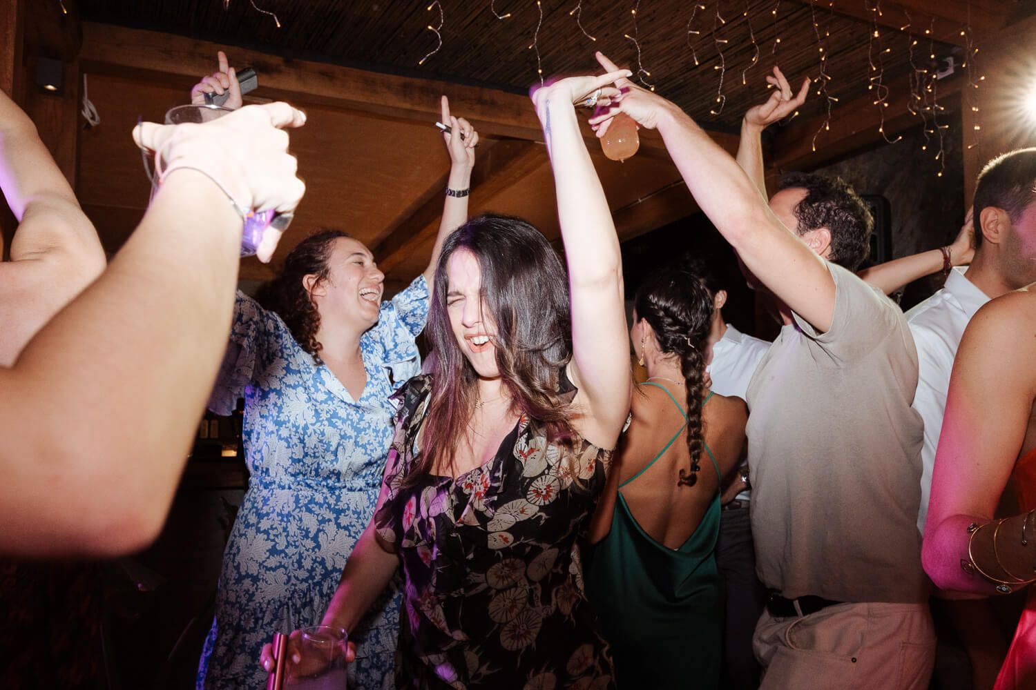Guests flooding the dance floor at a destination wedding in Paros