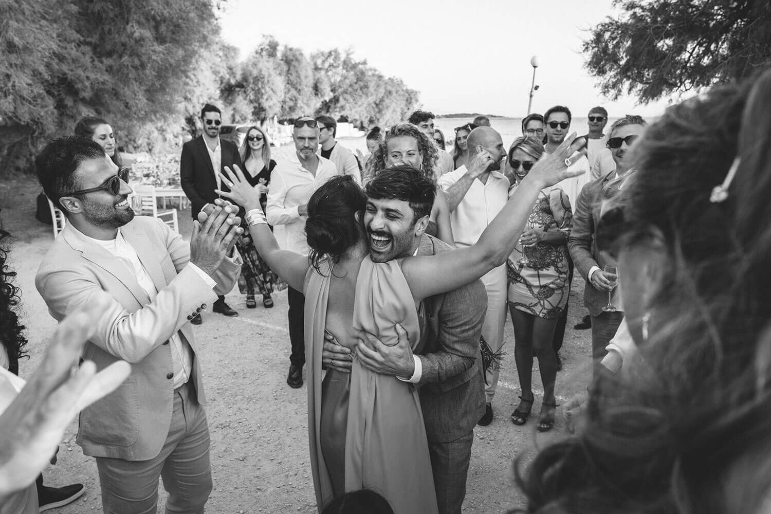 Guests greeting the bride and groom during a wedding reception in Paros Greece.