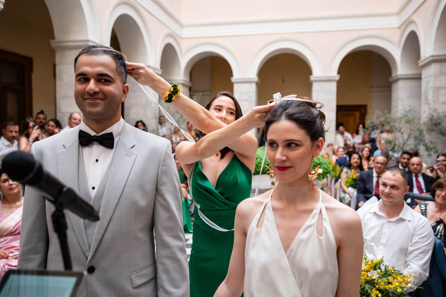Touching wedding ceremony taking place at a historic town hall