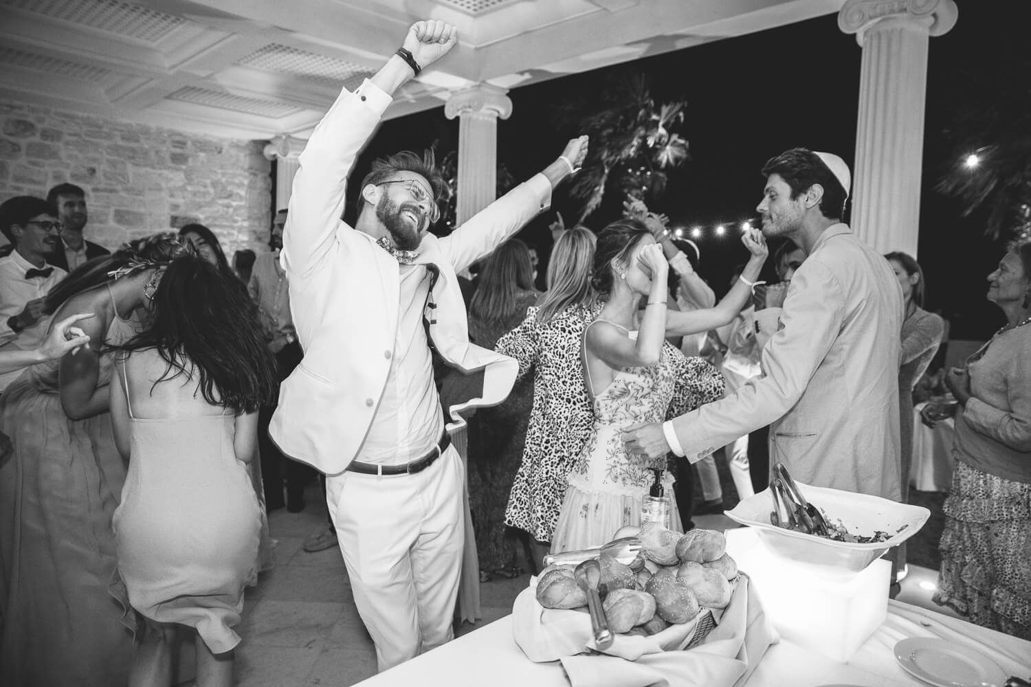 Candid moments of joy during Jewish wedding celebration in Greece