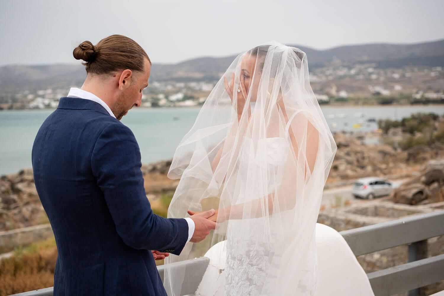 Close up of the groom putting the wedding ring on the bride's finger