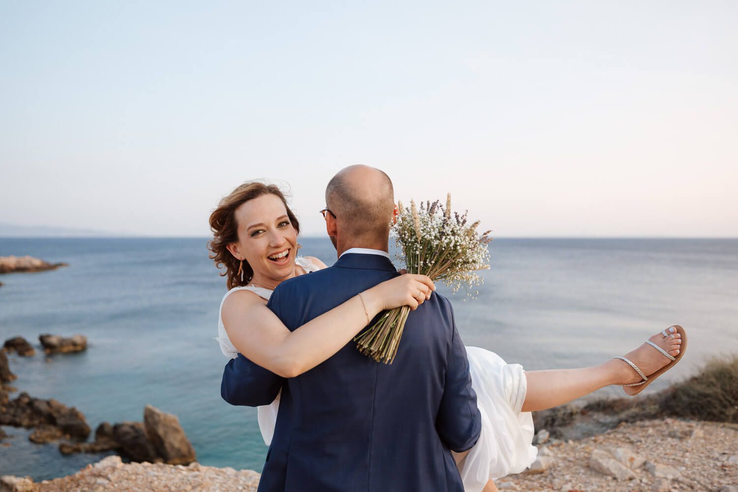 Dimitris and Ioanna embracing during a quiet portrait session after their ceremony