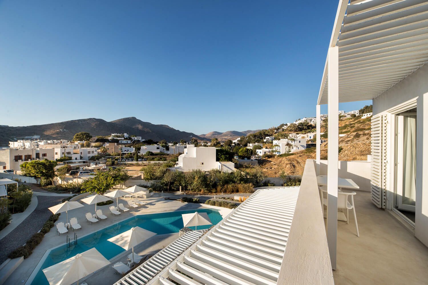 Expansive outdoor swimming pool featuring modern architectural lines