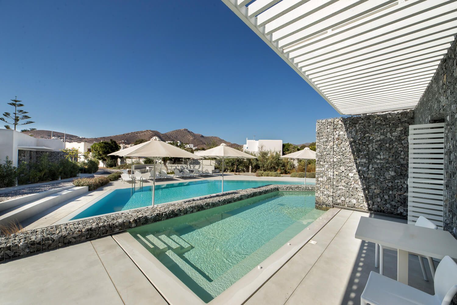 Expansive outdoor swimming pool featuring modern architectural lines