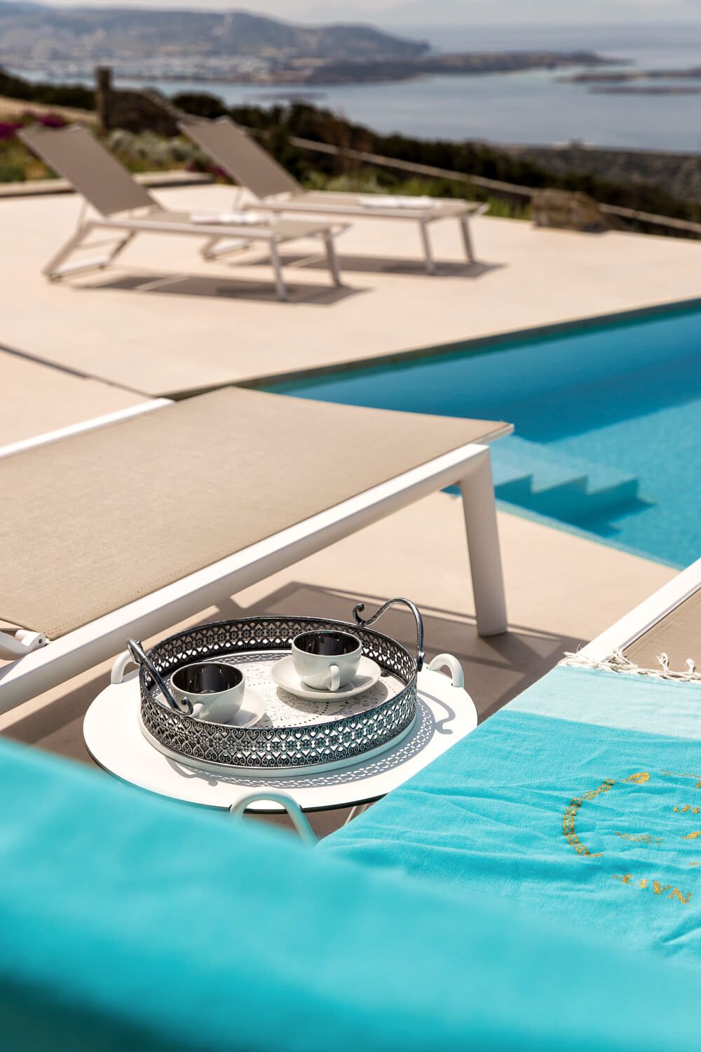 Premium outdoor furniture selection overlooking Antiparos
