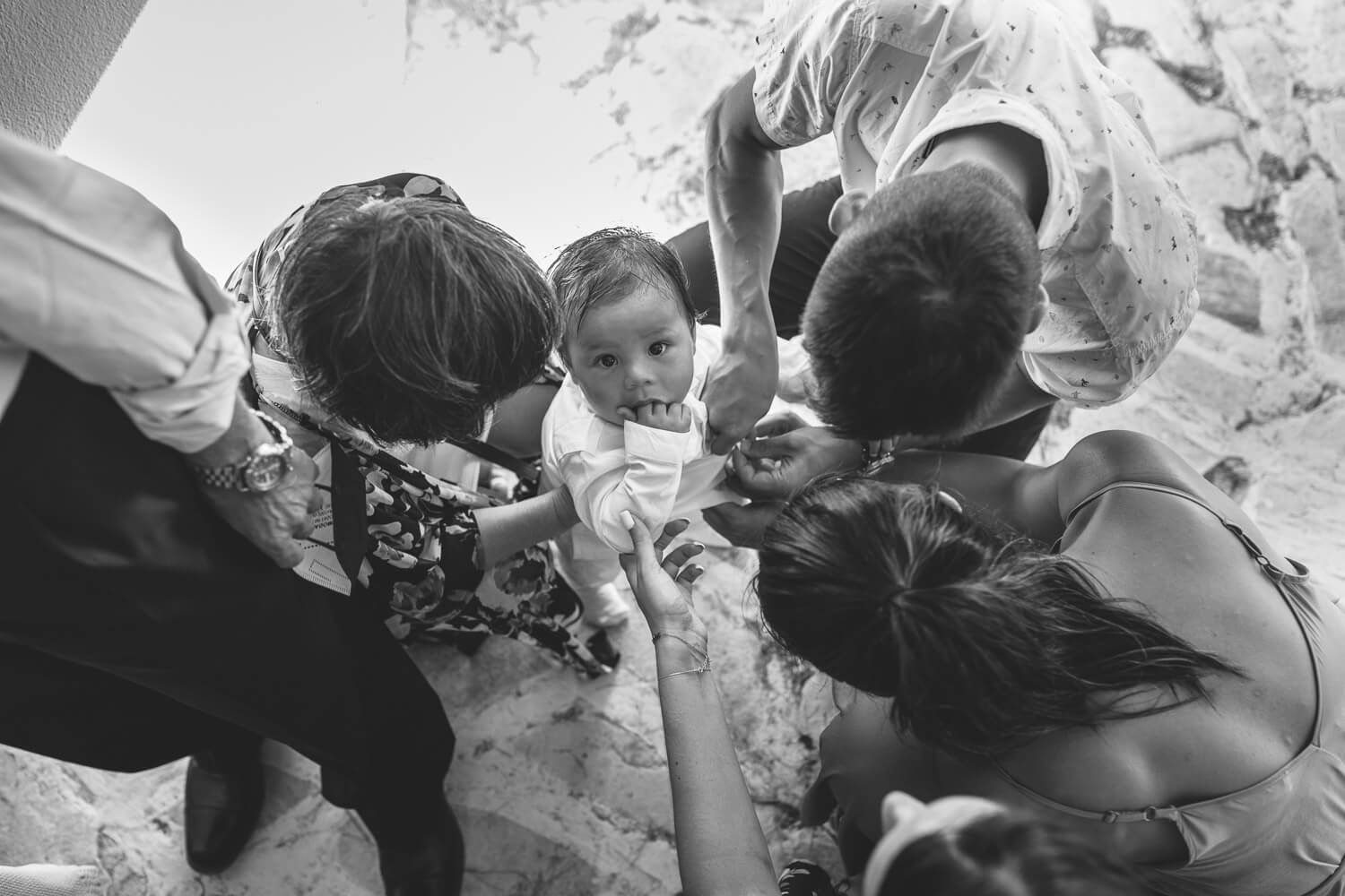 Intimate family baptism at Agios Georgios Antiparos