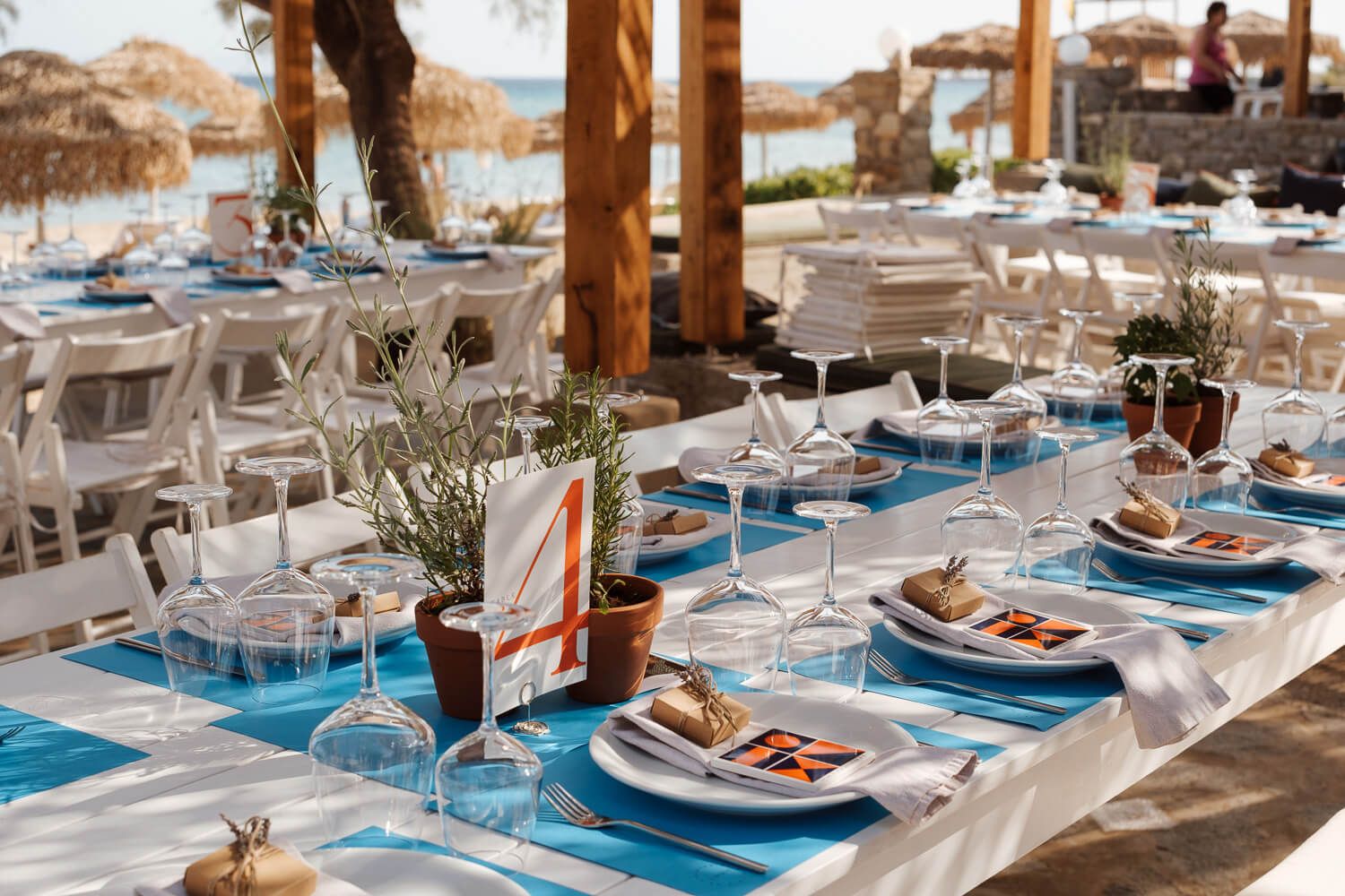 Shot of beautiful wedding reception decor and table settings at Rebel Bar Paros
