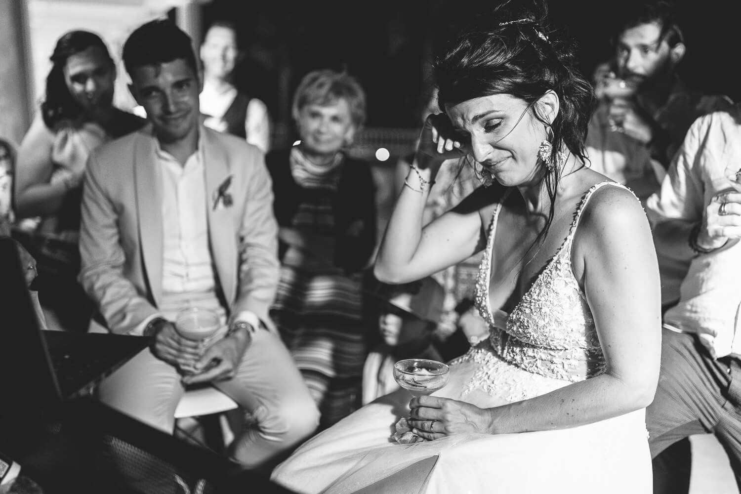 Candid shot of the guests laughing during the wedding speeches