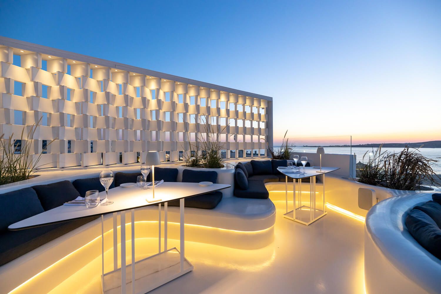 Illuminated restaurant tables offering a cozy nighttime experience