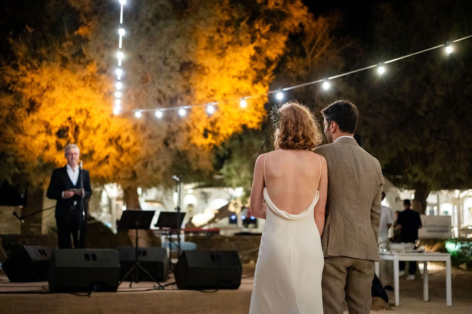 Emotional wedding speeches at a beachfront dinner in the Cyclades