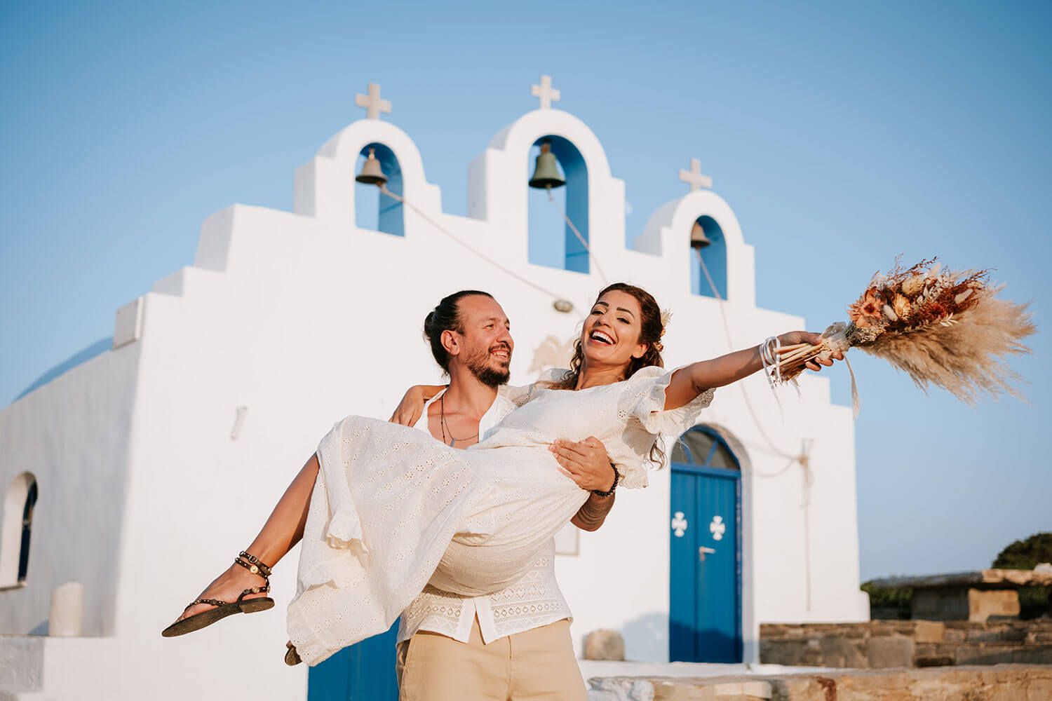 Playful and fun pre-wedding moments of a bohemian couple in Paros