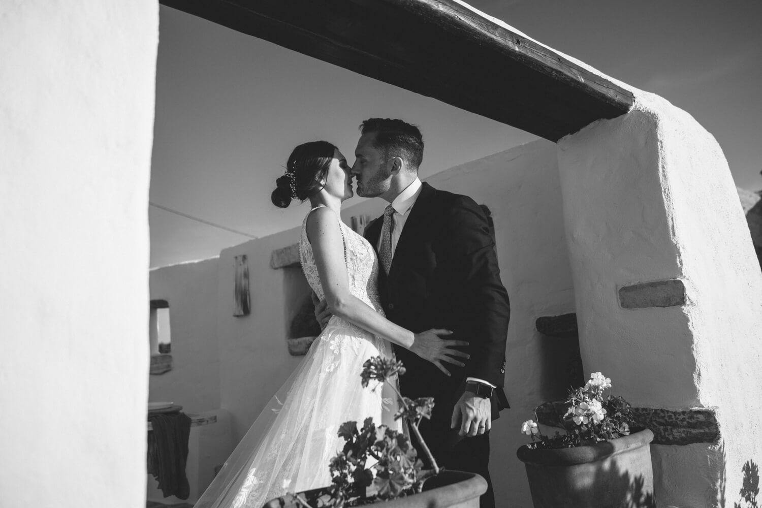 The couple kissing during their private elopement in the Cyclades