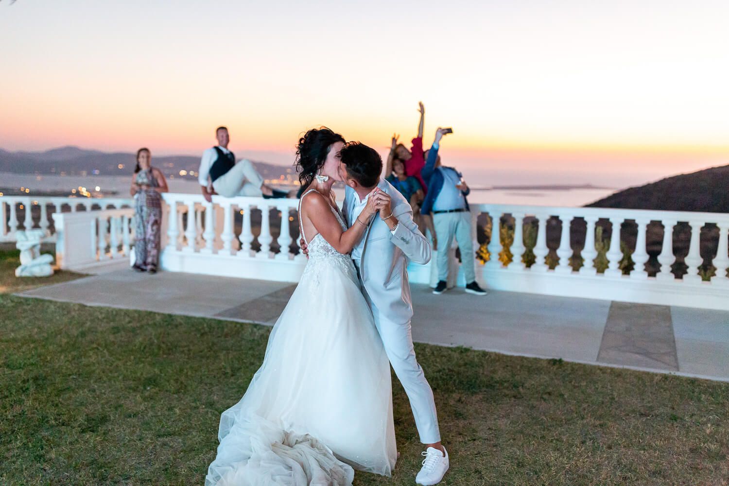 Couple kissing during an Italian wedding at Villa Aethra Paros