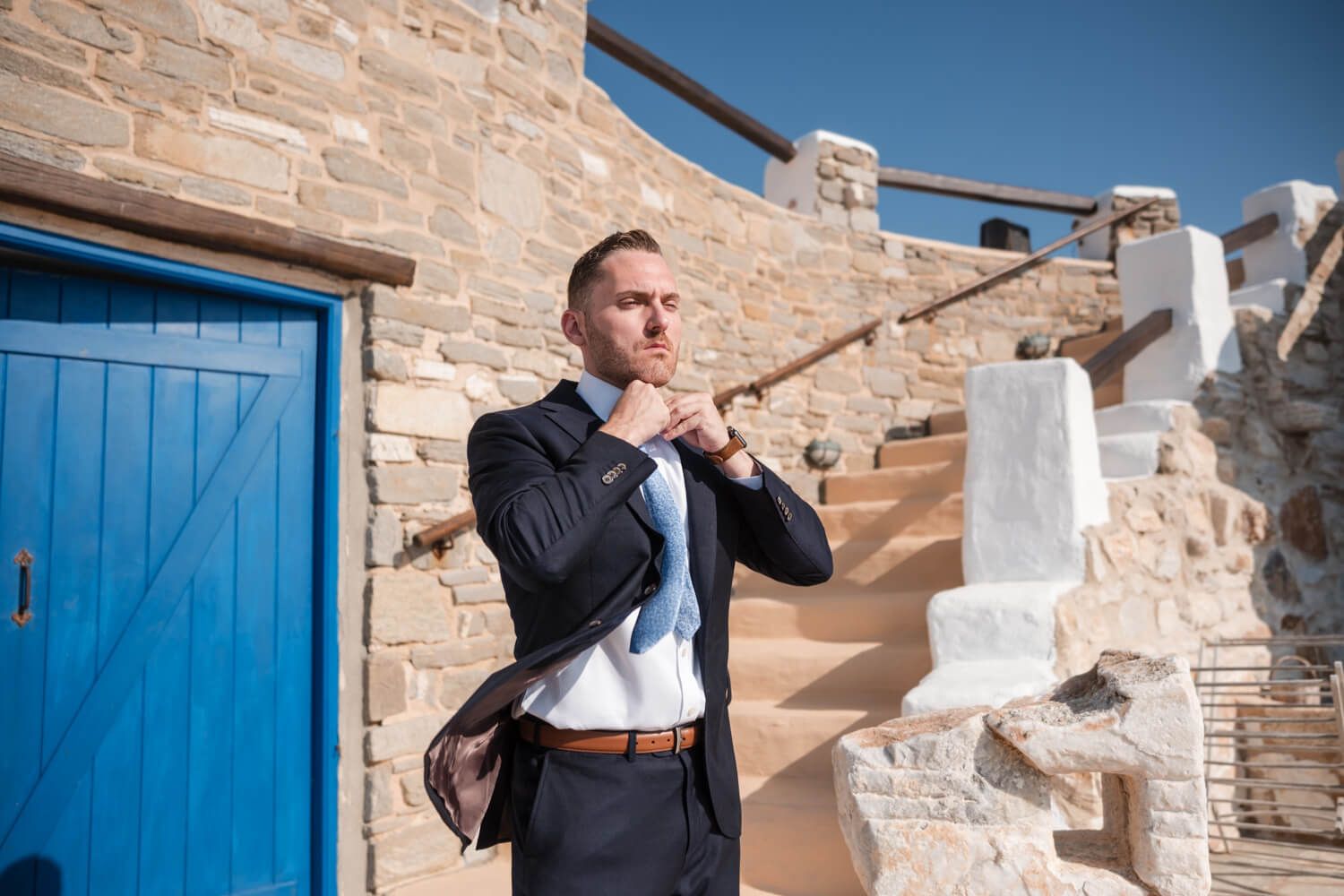 Groom Cody getting ready for his private villa wedding in Paros