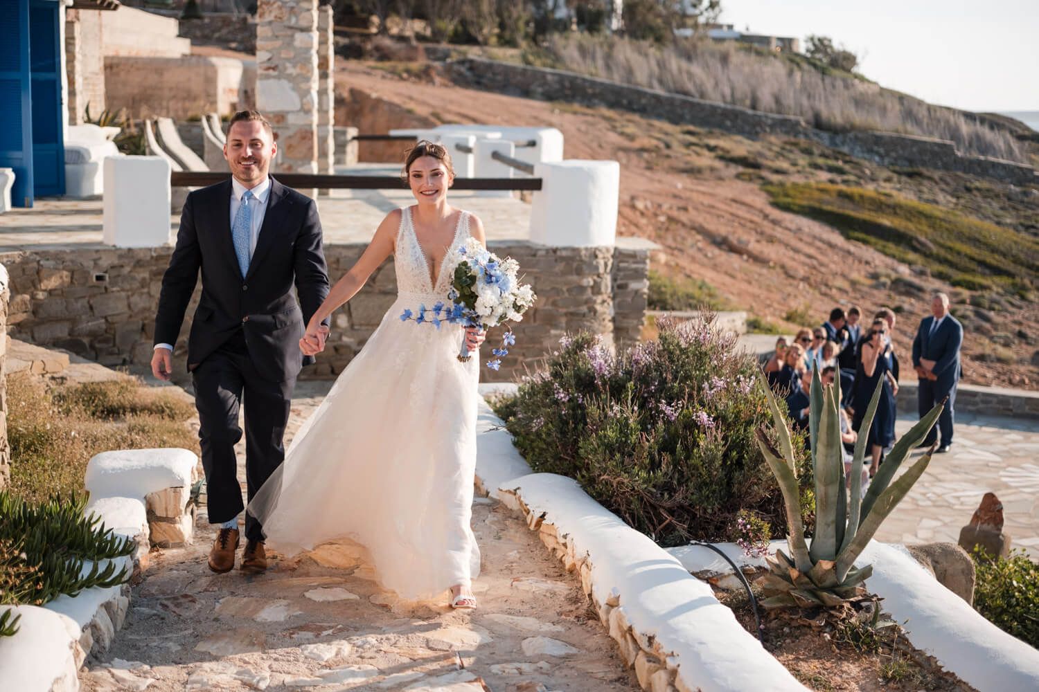 Joyful newlyweds walking together after their symbolic ceremony