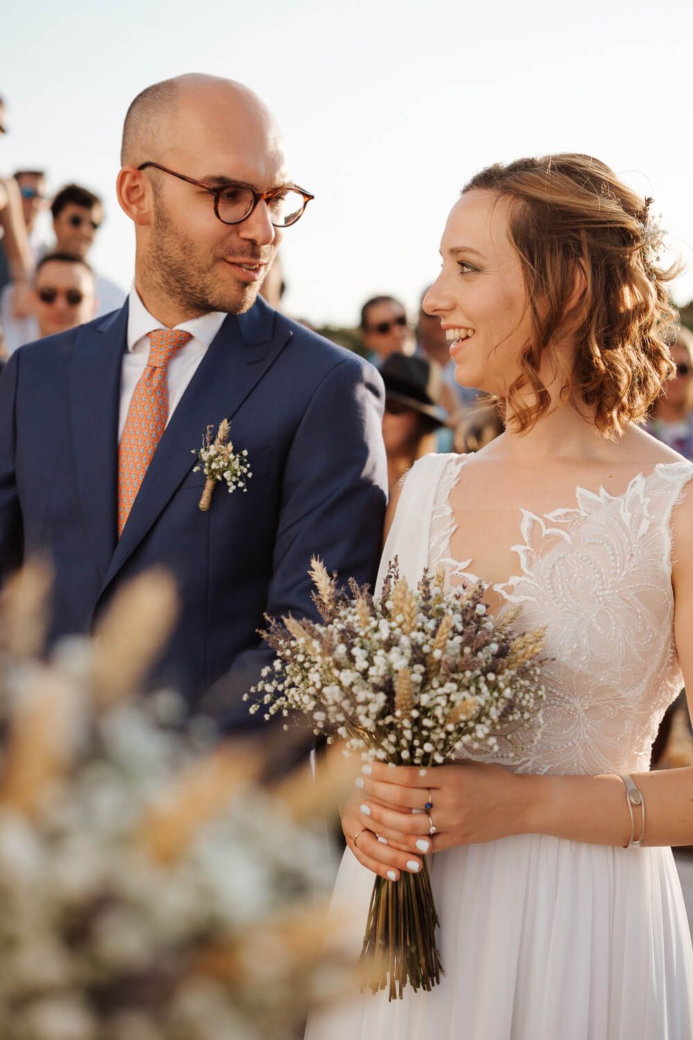 Bride and groom sharing a happy look during their Paros wedding at Pyrgaki