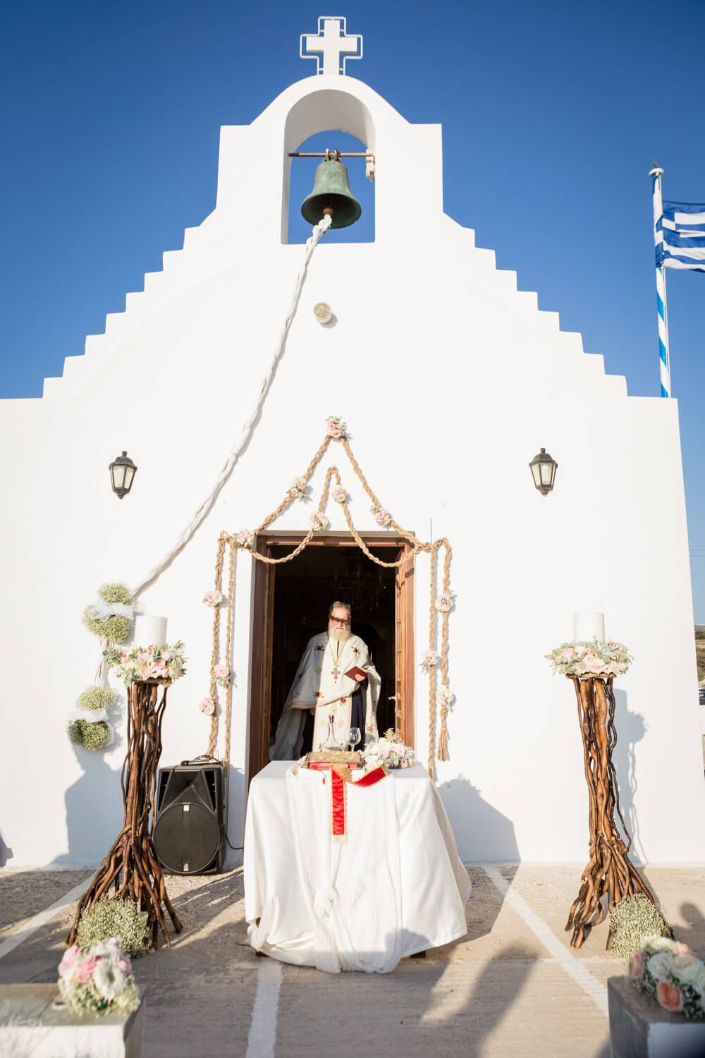 Wedding ceremony at Agios Konstantinos church by the sea in Milos