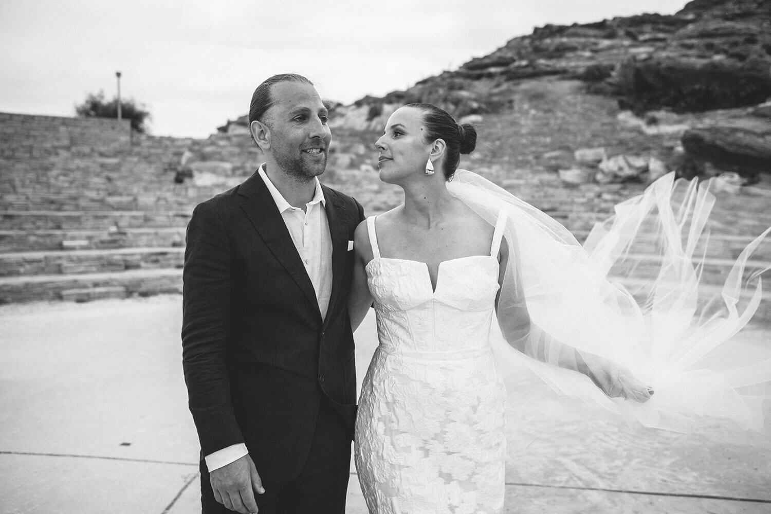 Couple walking through the wild natural landscape of Monastiri Paros