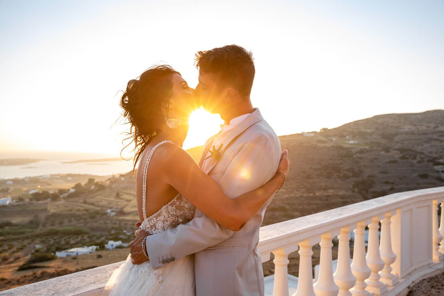 Couple kissing during an Italian wedding at Villa Aethra Paros