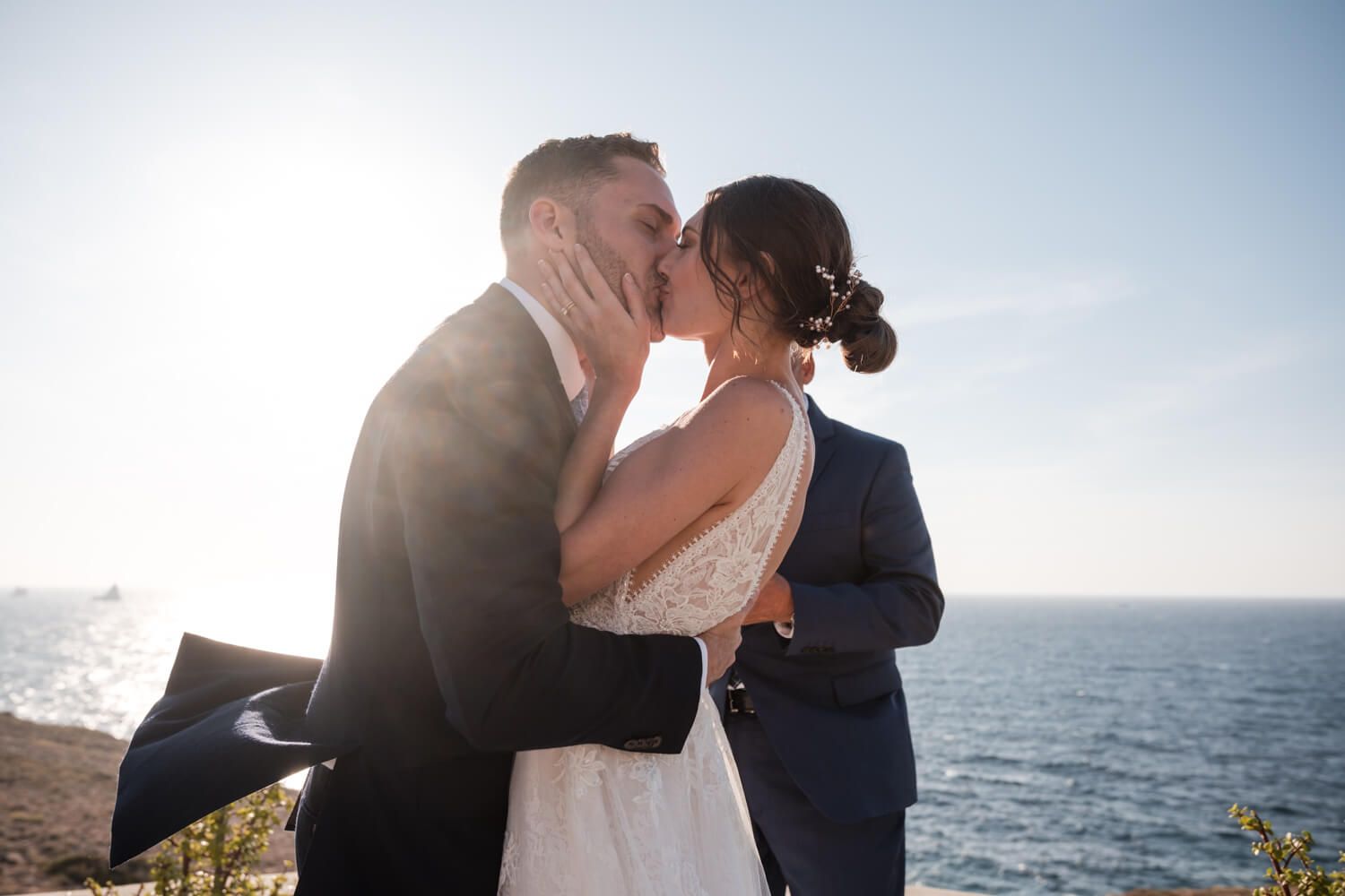 Newlyweds sharing their first kiss as husband and wife at a luxury villa