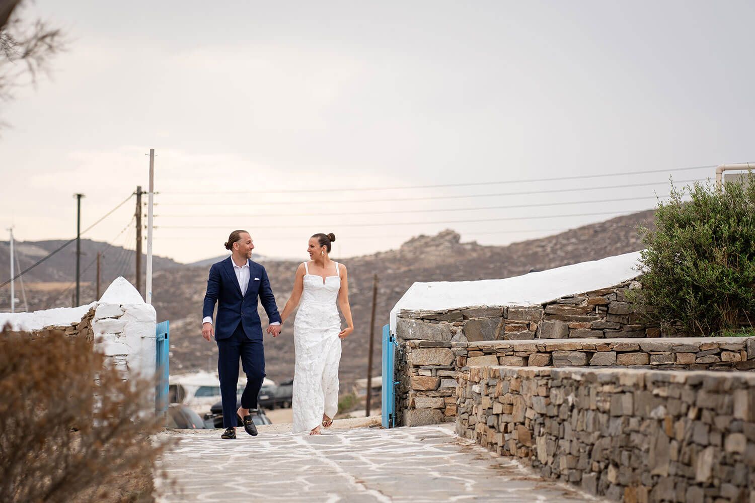 Couple walking through the wild natural landscape of Monastiri Paros