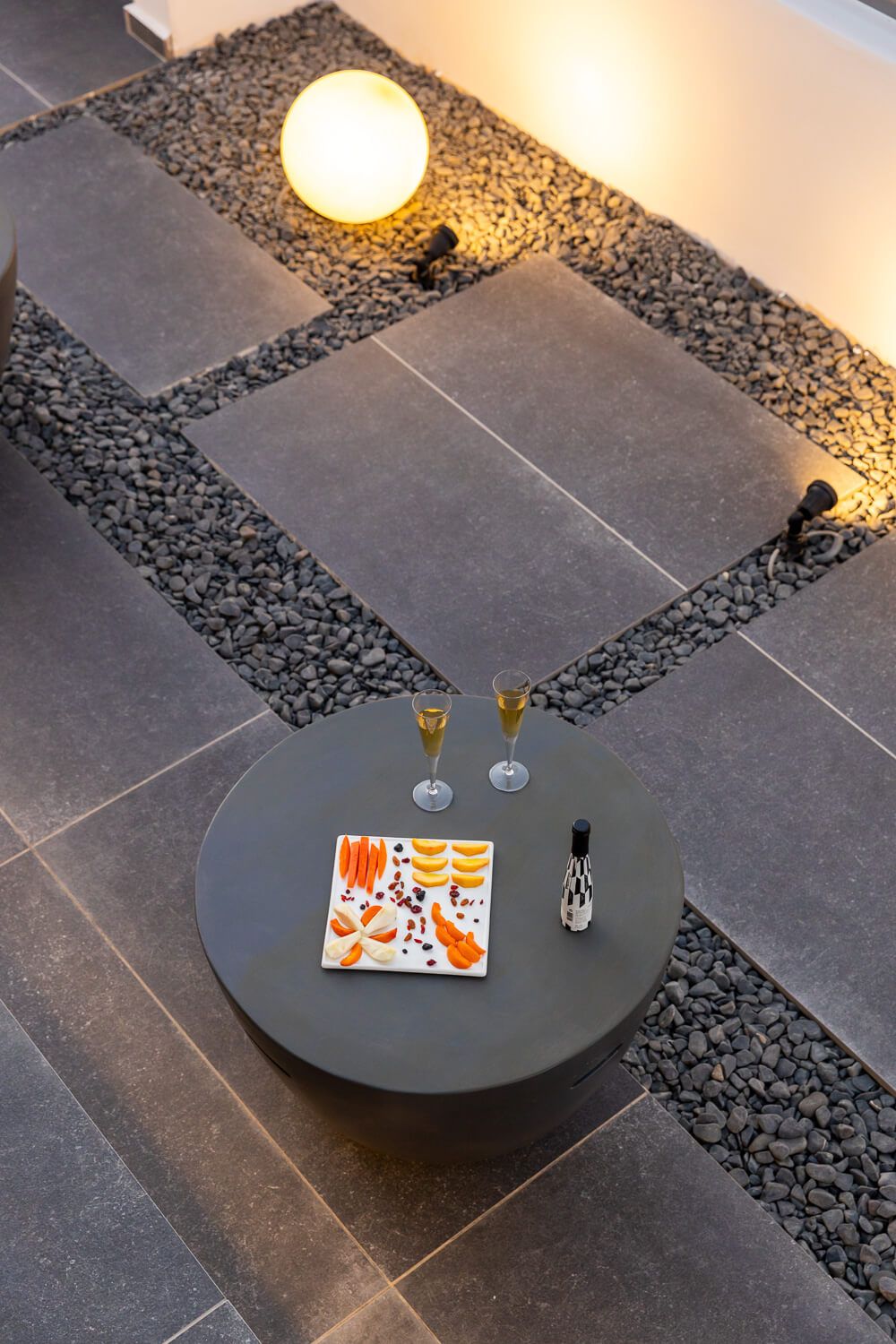 Beautifully lit exterior lounge spaces during the Paros sunset