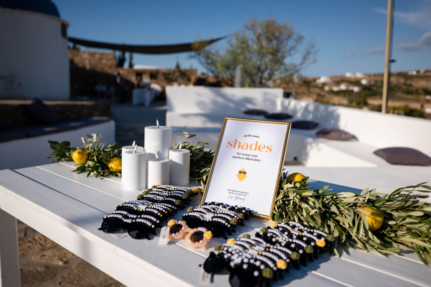 A table with sunglasses for the guests of a wedding at the Fladakia Estate in Paros